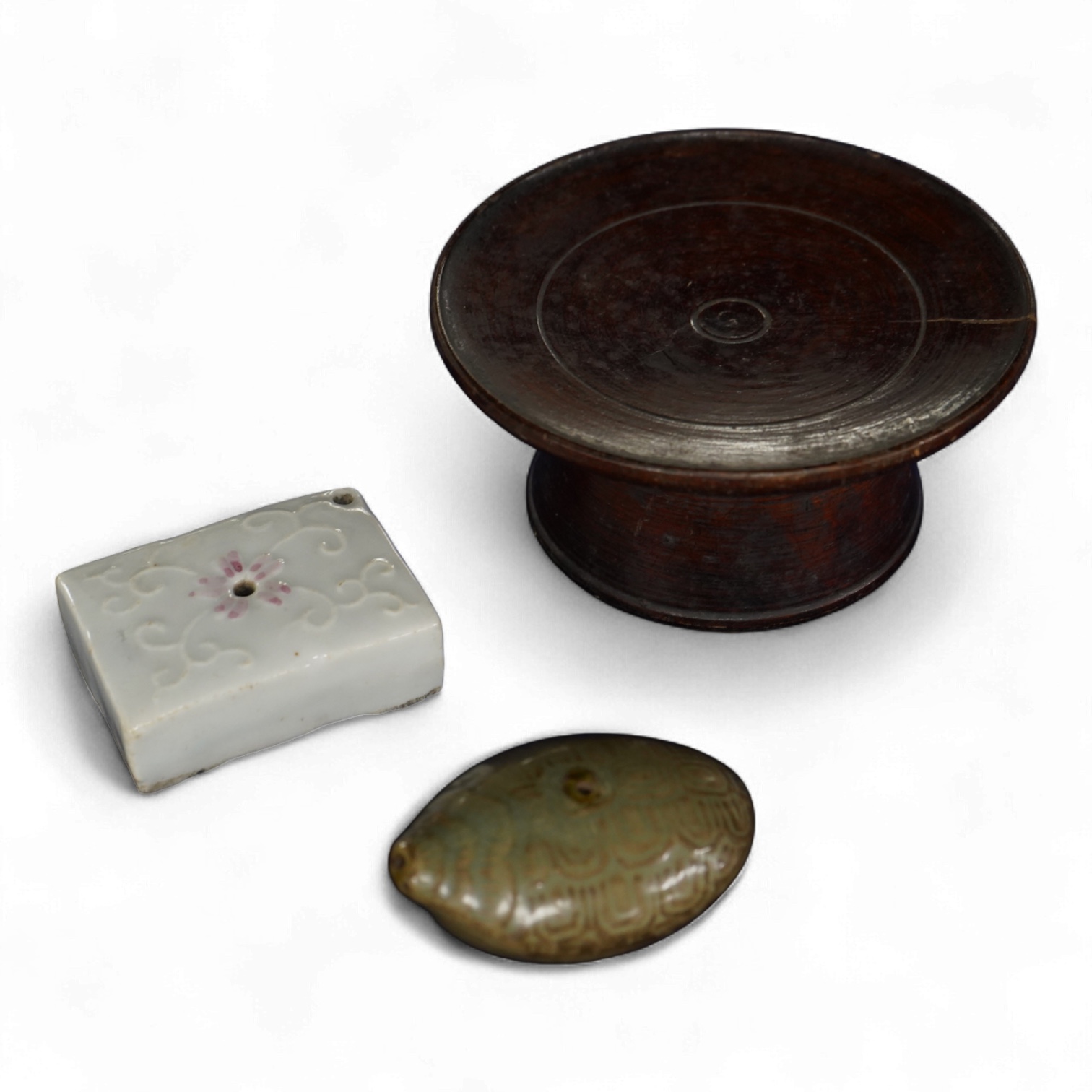 Two 19th century Korean ceramic water droppers and a Korean turned wood cup stand, oval water dropper 8cm long